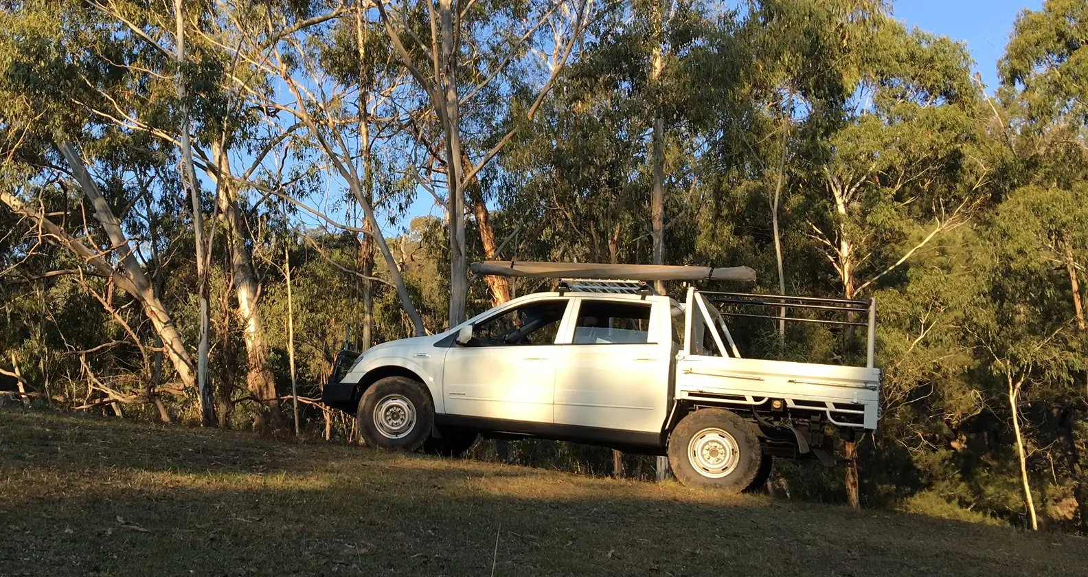 White dual-cab tradie ute with a flat tray, ready for a day of quotes and paperwork